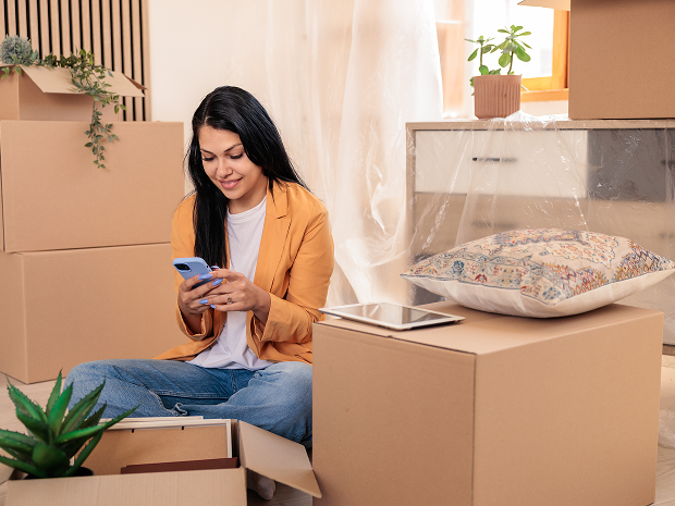 Relaxing during a home move with phone